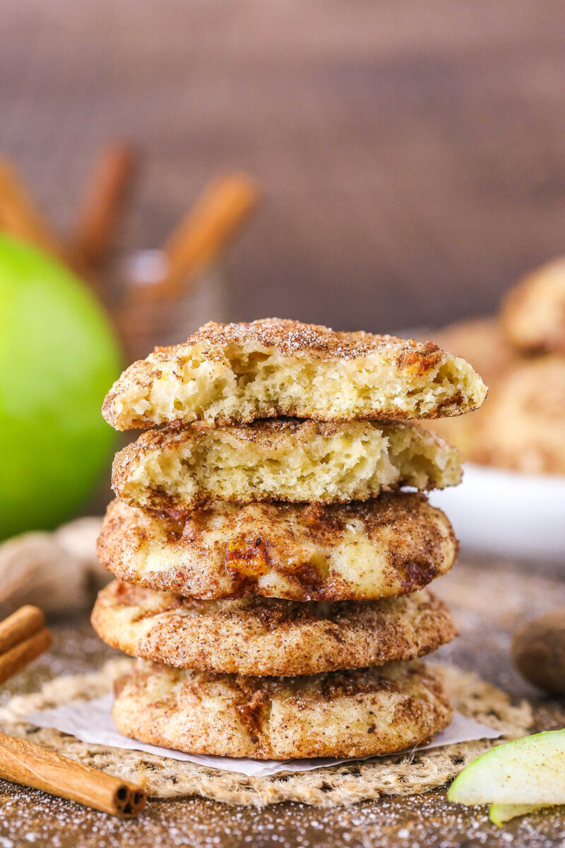 apple snickerdoodles in a stack with broken cookie on top