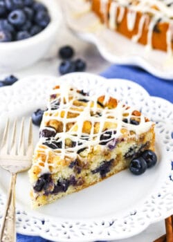 close up of slice of Blueberry Streusel Coffee Cake on white plate