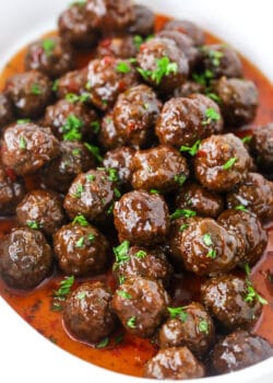 Grape Jelly Meatballs in a pile in white dish
