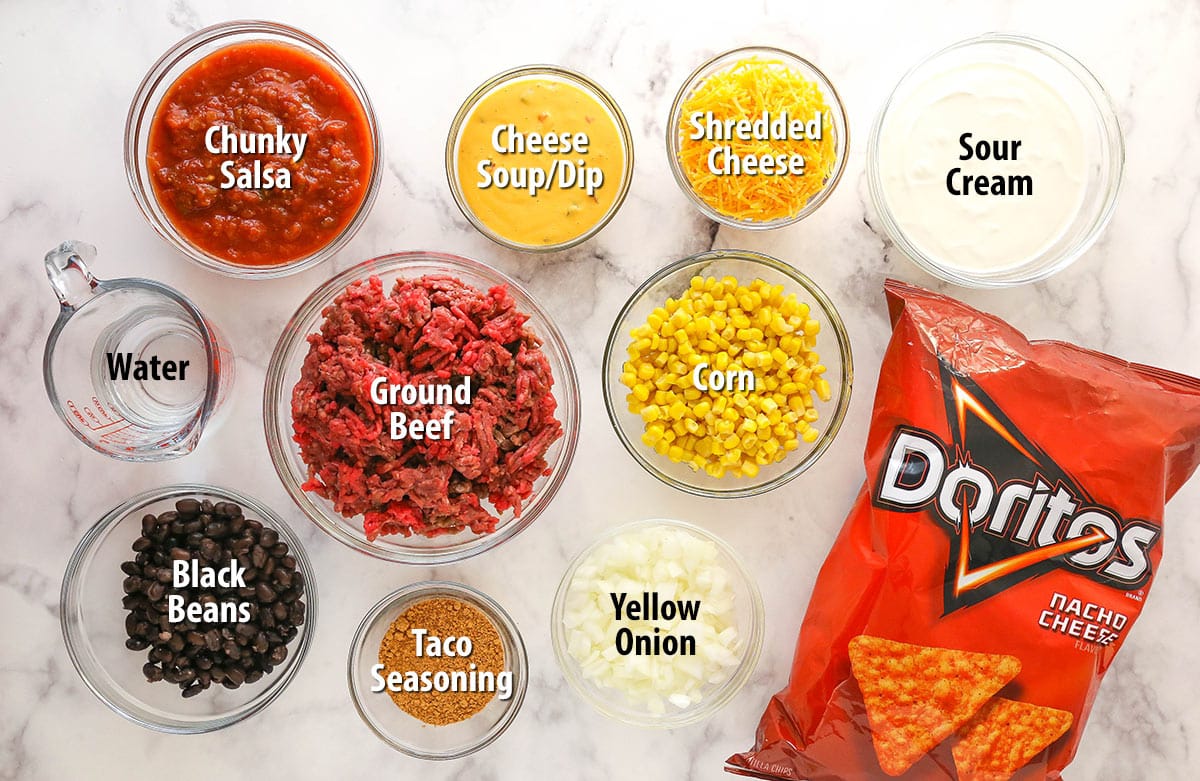 Ingredients for Dorito casserole separated into bowls.