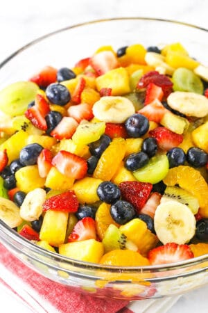 close up of fruit salad in clear bowl