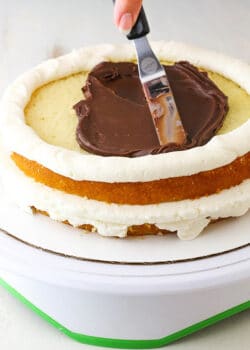 adding chocolate ganache (How to Stack a Cake Tutorial)