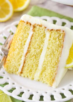 A slice of lemon layer cake on a plate.