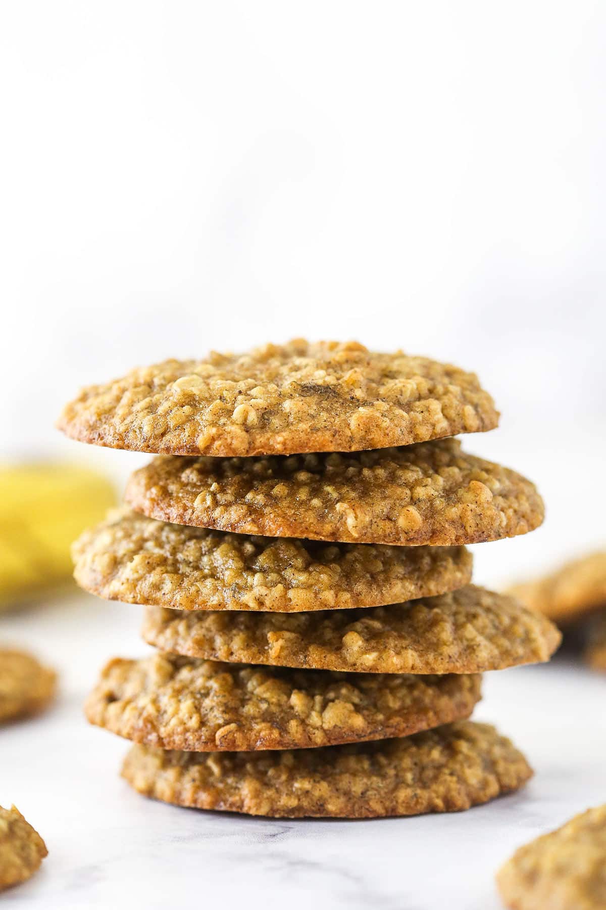 6 Moist and Chewy Banana Oatmeal Cookies stacked one on top of the other.
