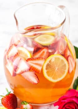 Rosewater Rosé Sangria with slices of strawberries and lemon