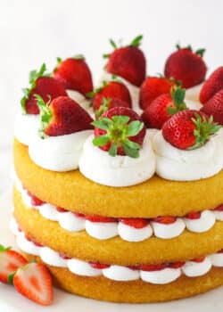 Strawberry shortcake cake on a serving platter.