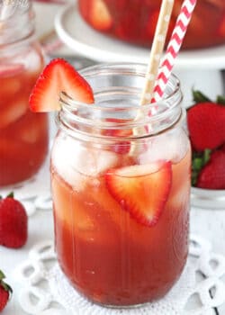 Close-up of a Mason Jar of Strawberry Vanilla Sweet Tea with two straws