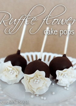 Ruffle flower cake pops on white plate